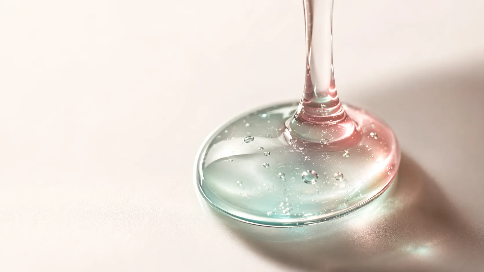 A glossy drop of snail mucin essence catching the light — does snail mucin really work?