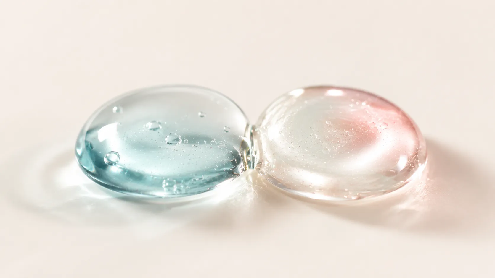 Snail mucin vs hyaluronic acid — a clear water drop and a glossy snail essence drop side by side